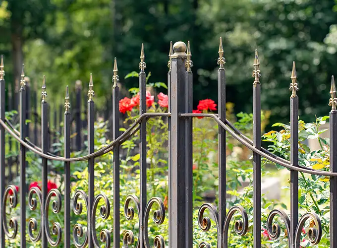 ornamental iron fence installed next to a garden in Springfield IL